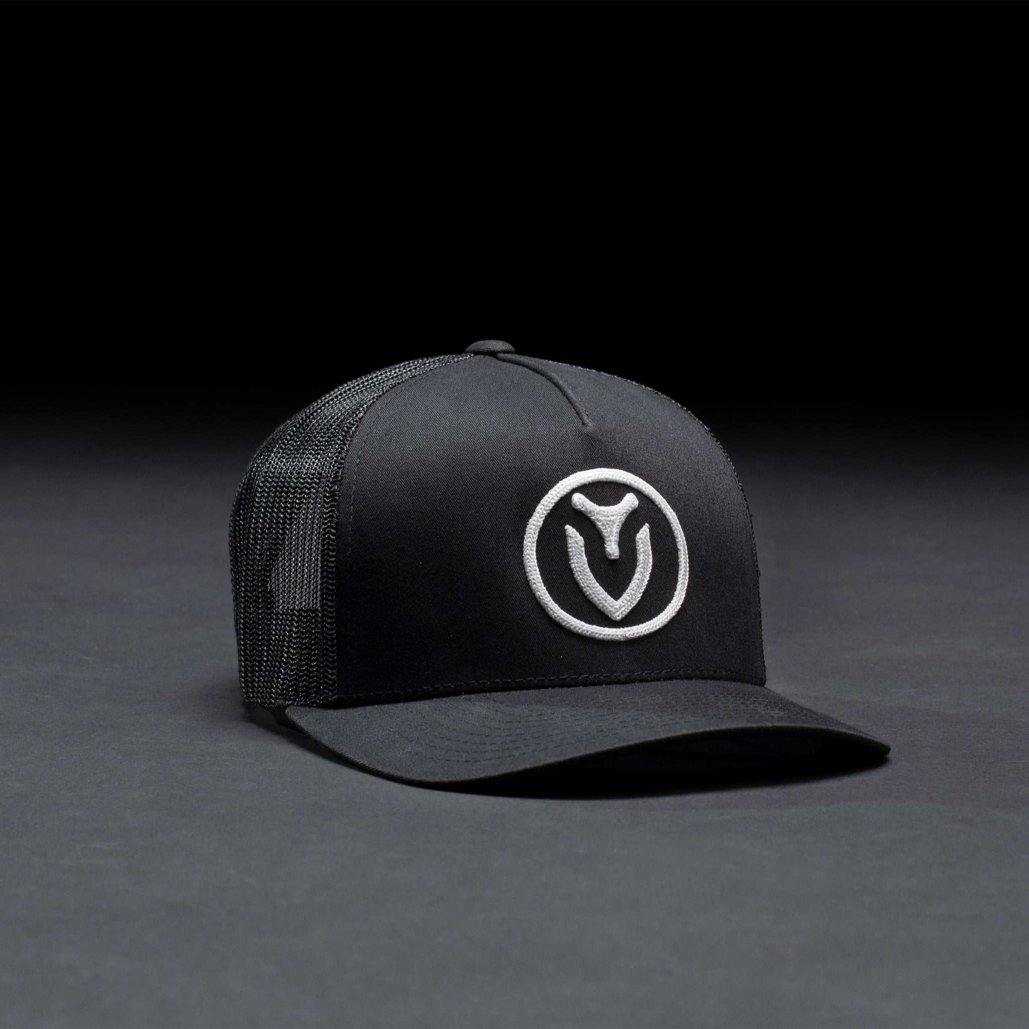 Black hat with VESSEL logo in black studio