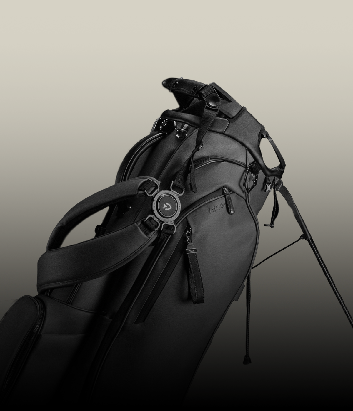 Black golf stand bag against a taupe background