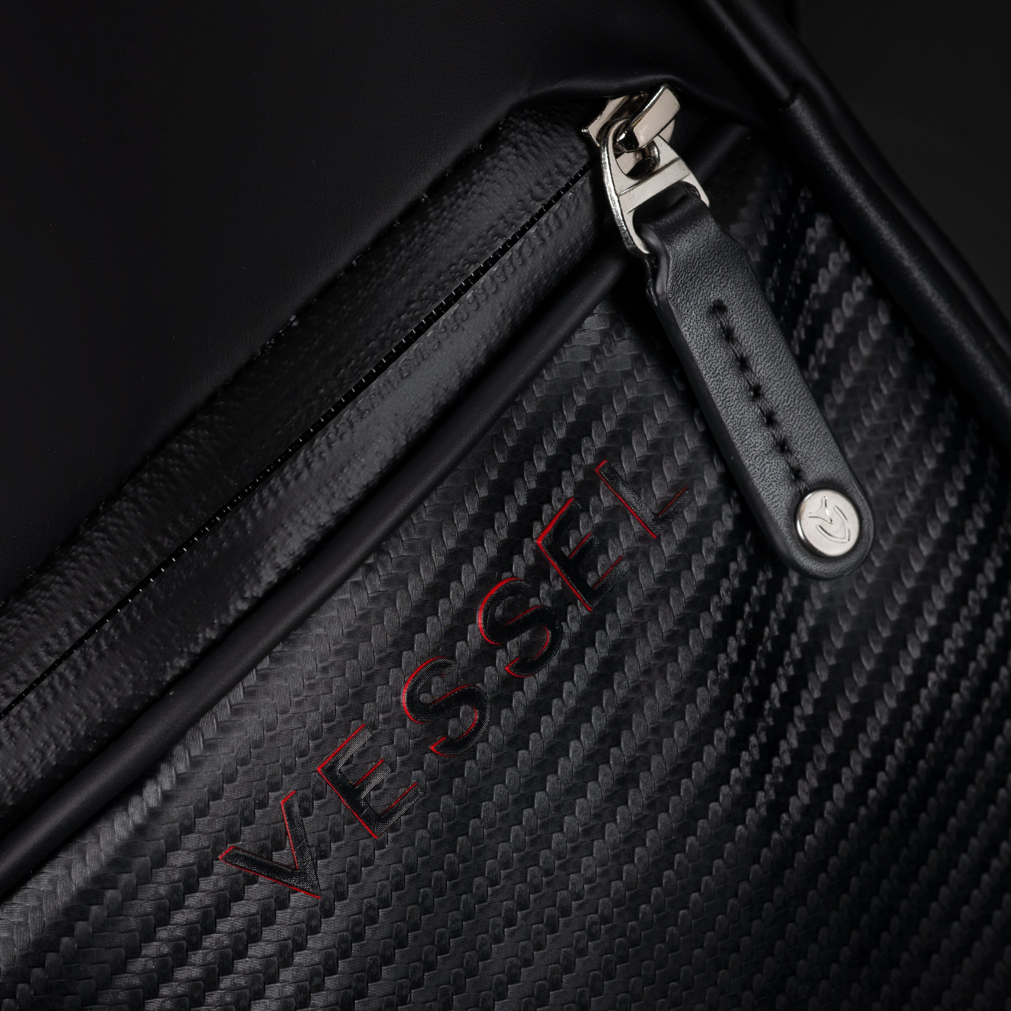 close up of vessel logo on nightfire lux cart ii golf bag
