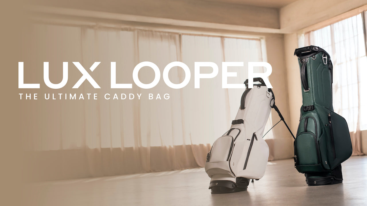Two Lux Looper Golf Stand Bags in a taupe colored room