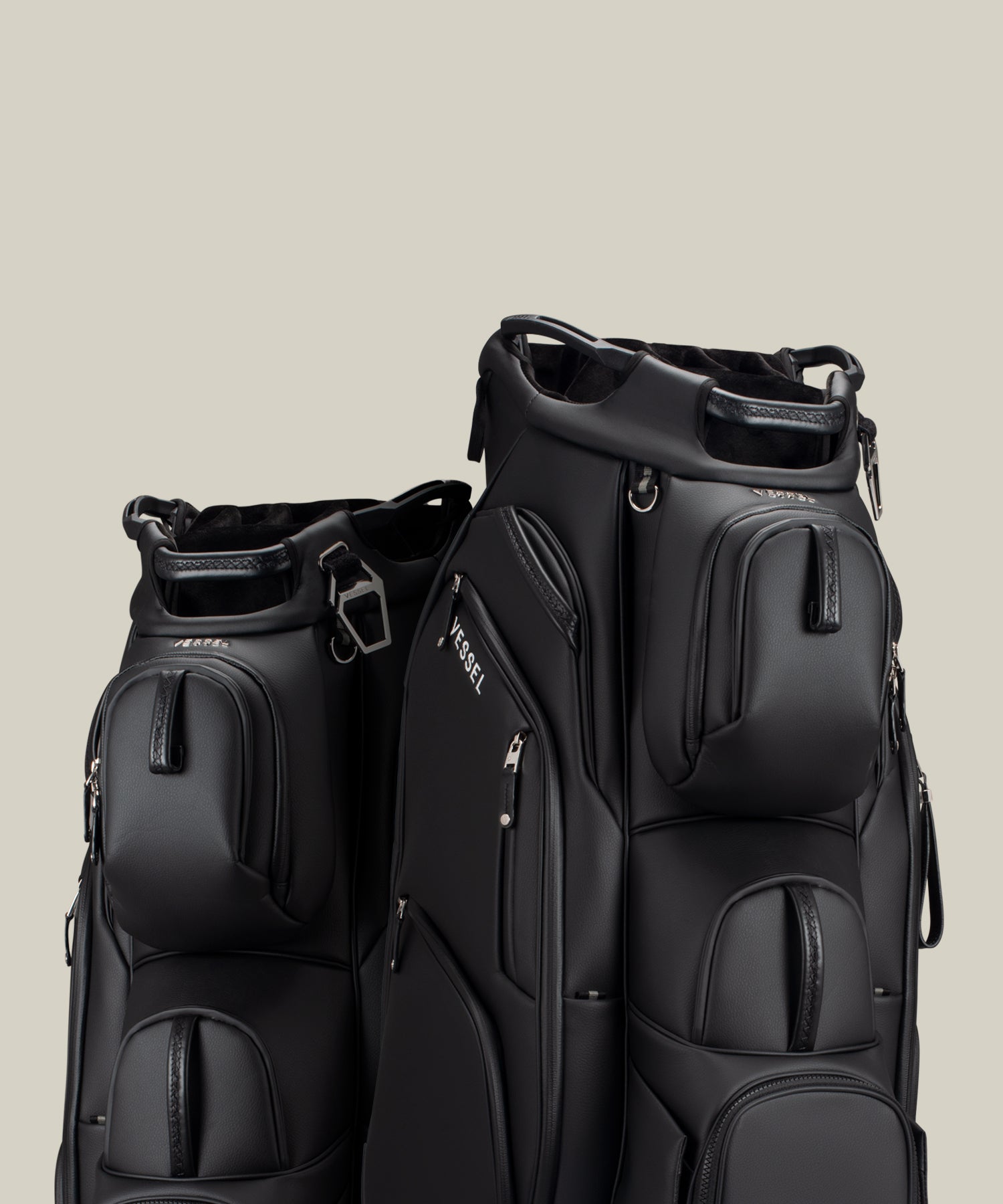 Two black Lux Pro Cart II cart bags against a taupe background