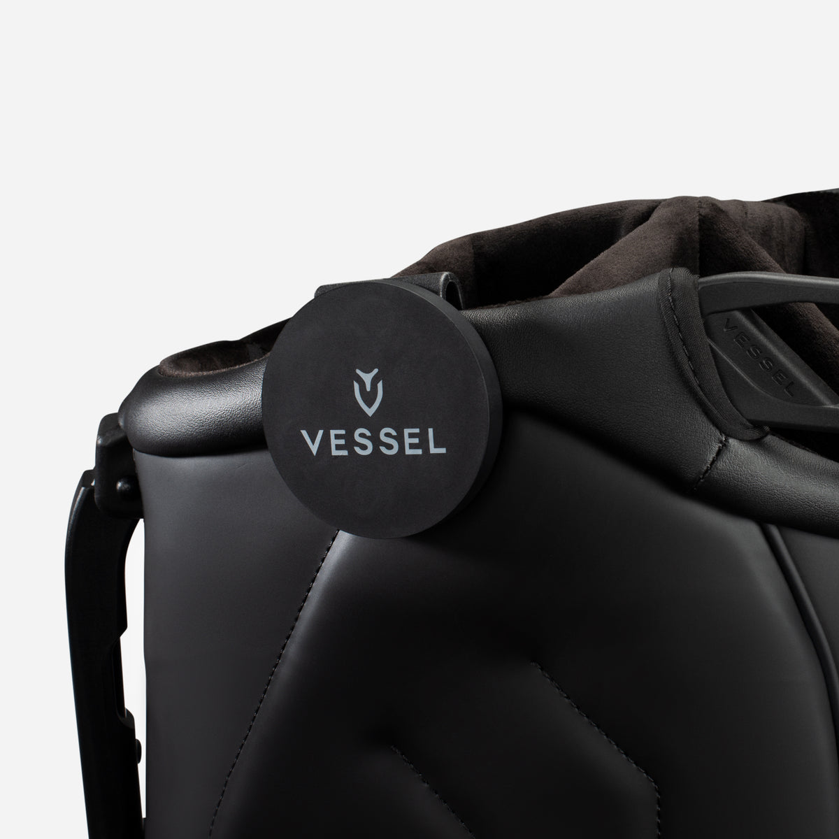 VESSEL x MagnetOwl Magnetic Landing Pad clipped onto vessel stand bag