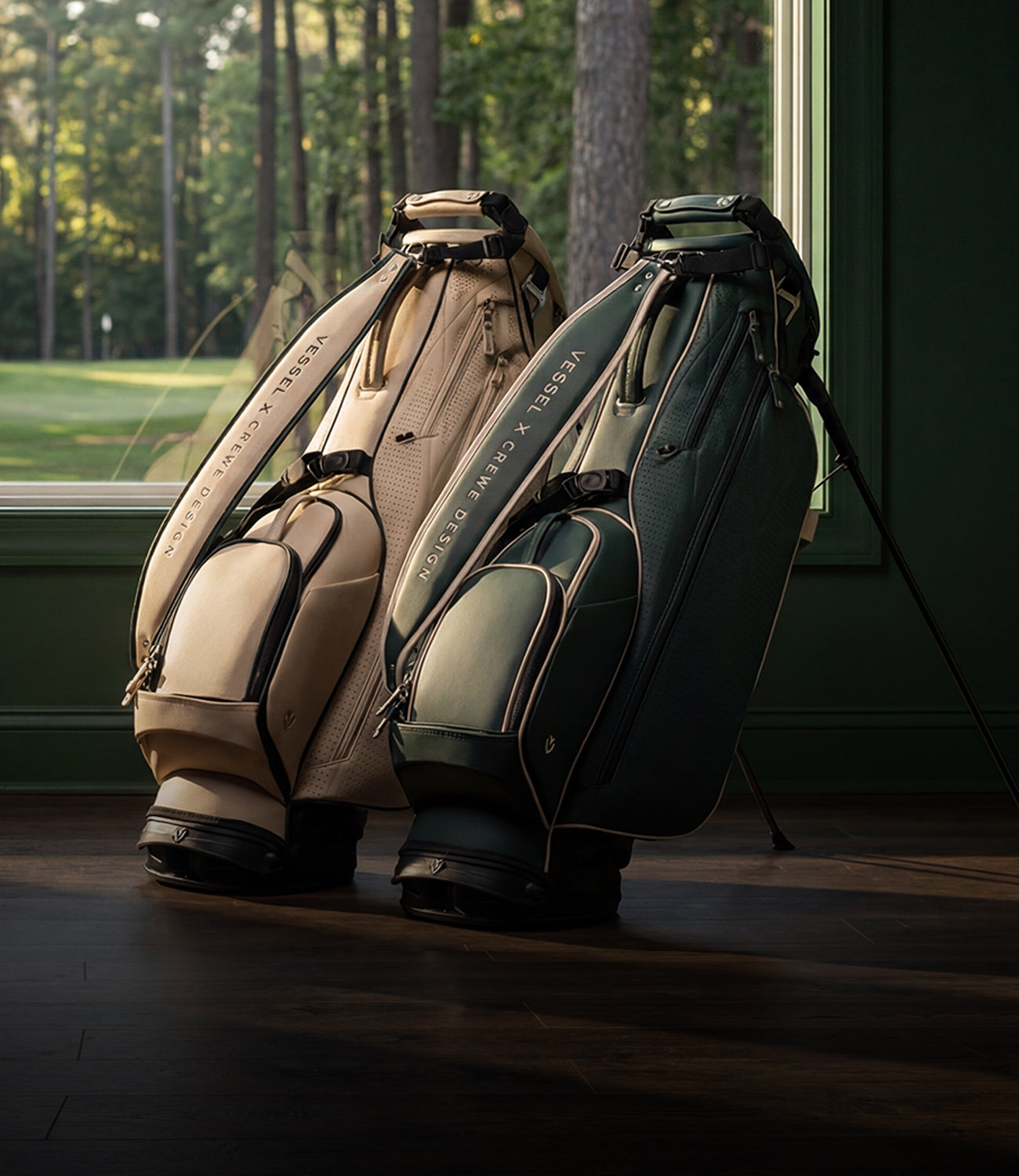 Two leather golf stand bags in a green bedroom next to a window