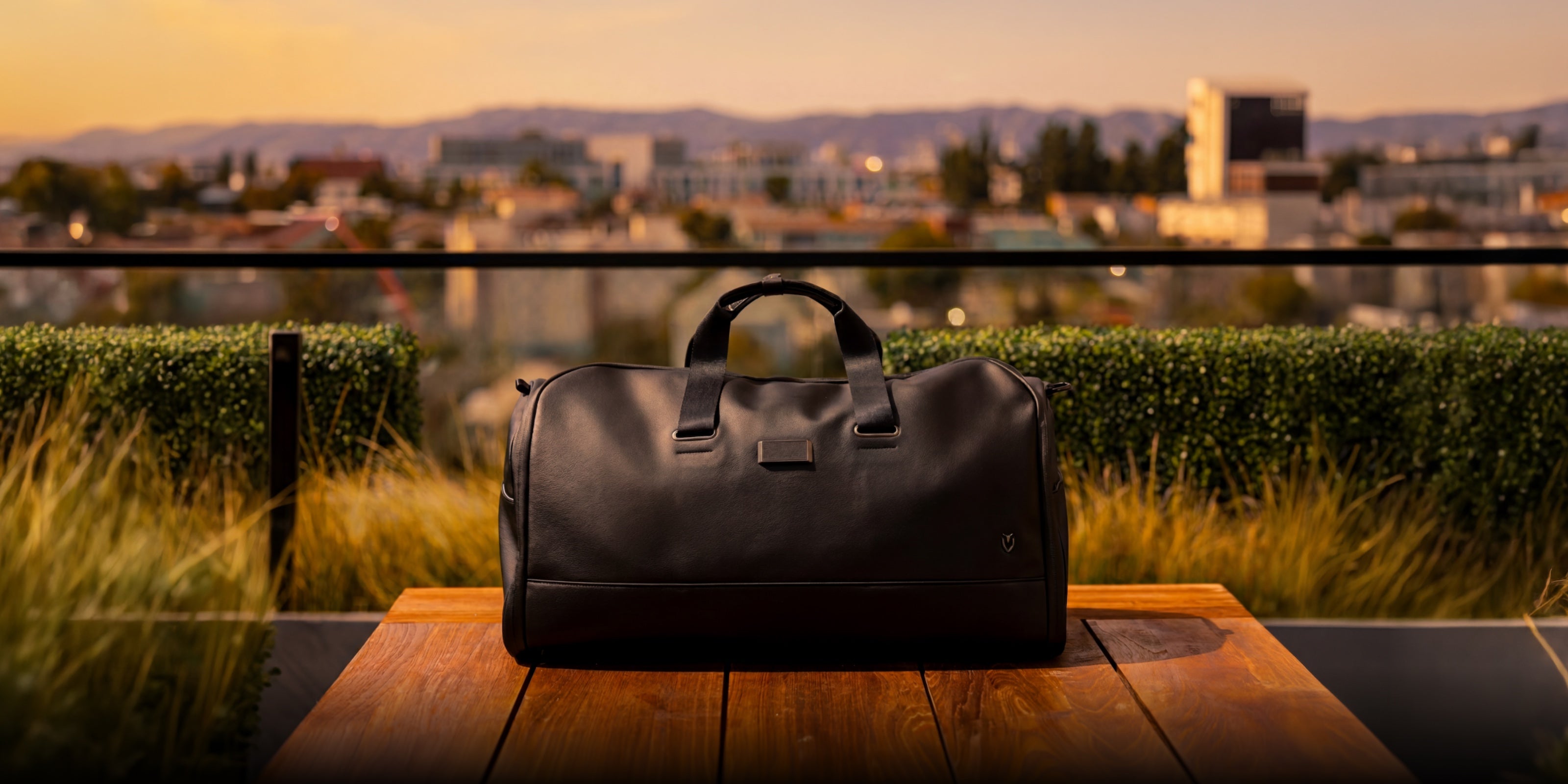 Black leather garment duffel in golden hour lighting