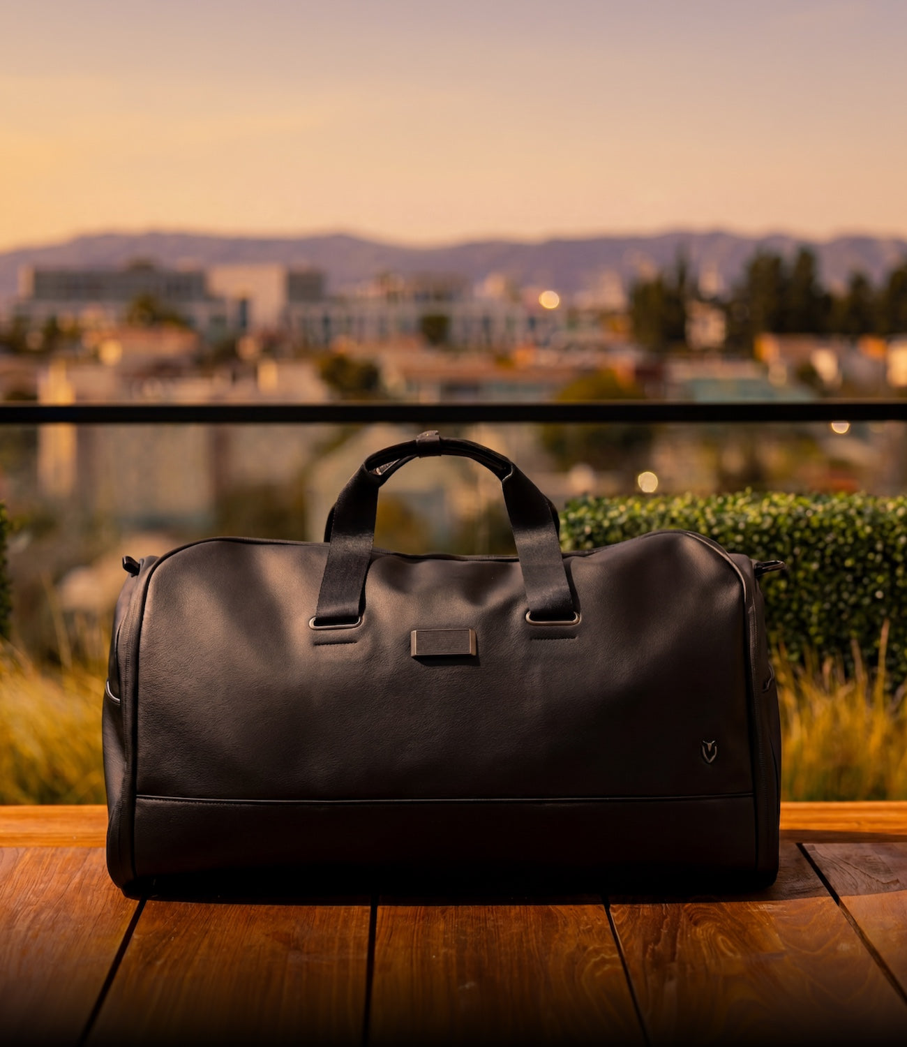 Black leather garment duffel in golden hour lighting