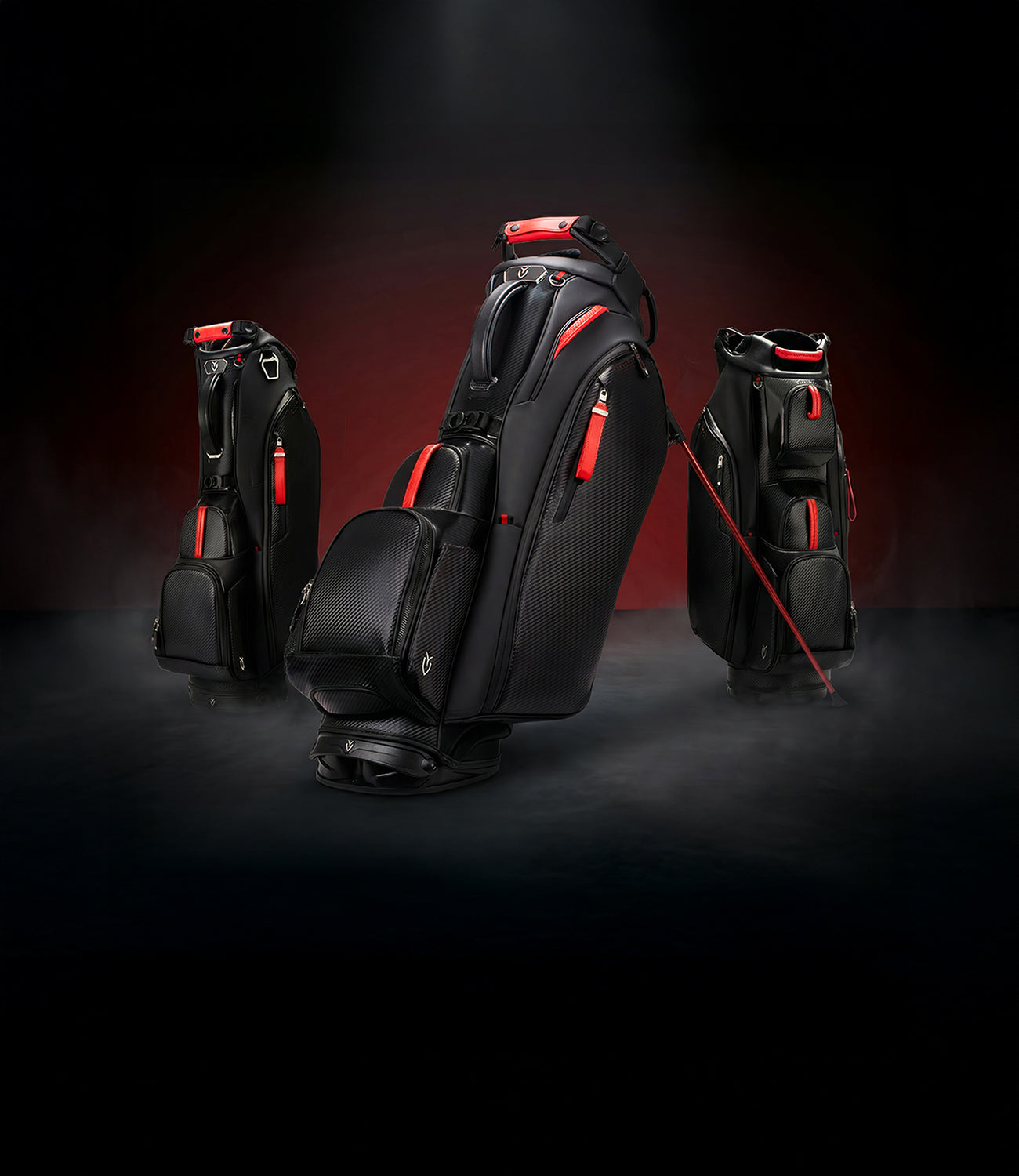 Three black golf bags with red accents against a dark red background