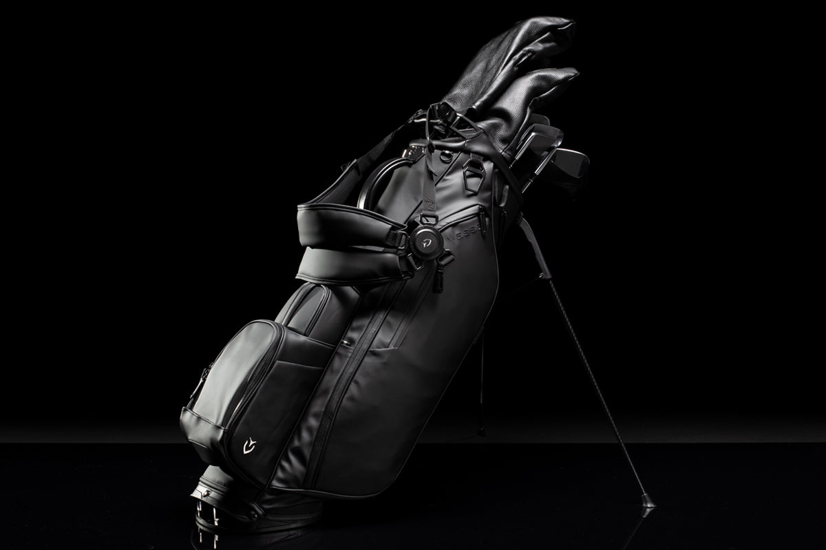 Black Player IV golf stand bag in a black studio