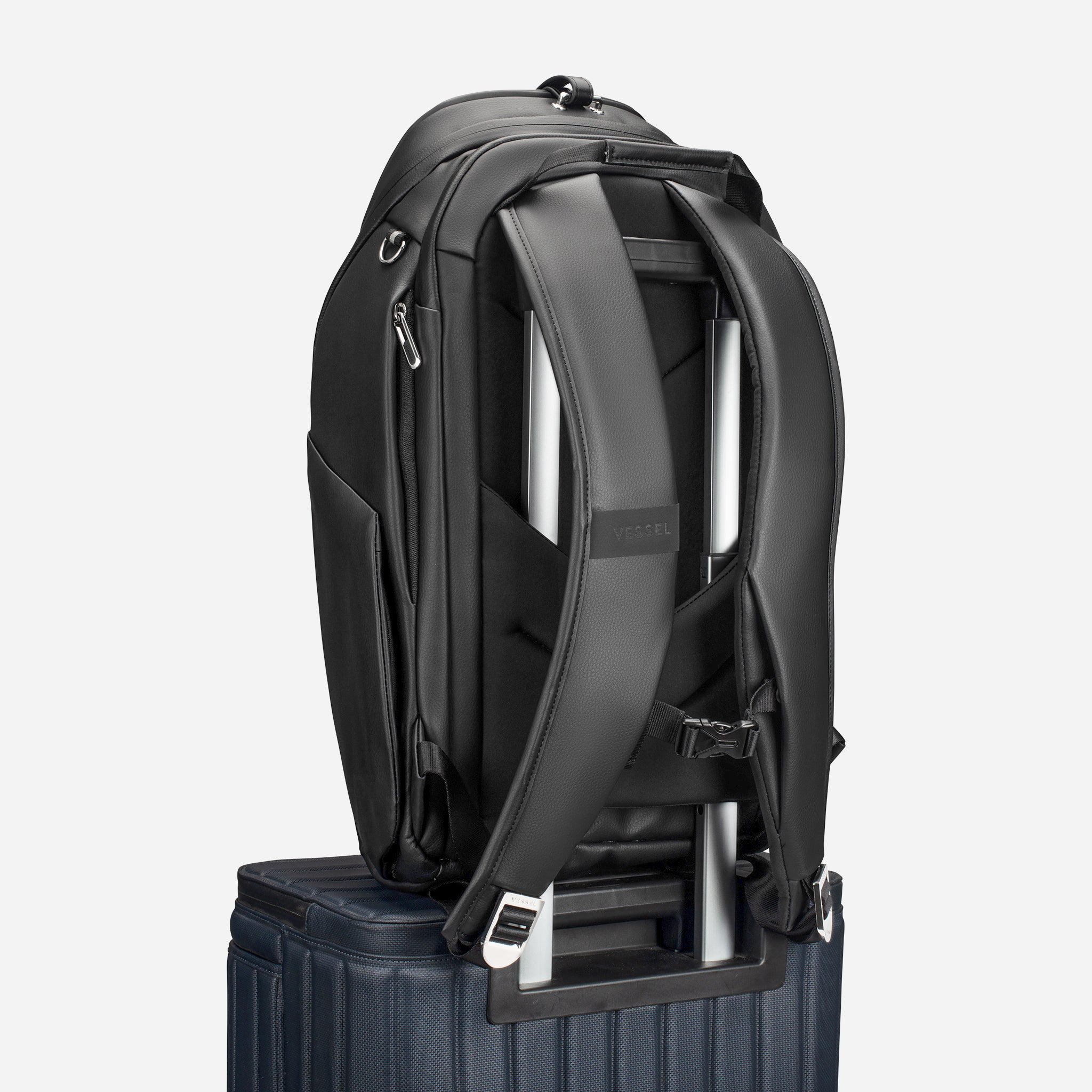 Black PrimeX 2.0 Plus Backpack sitting on luggage