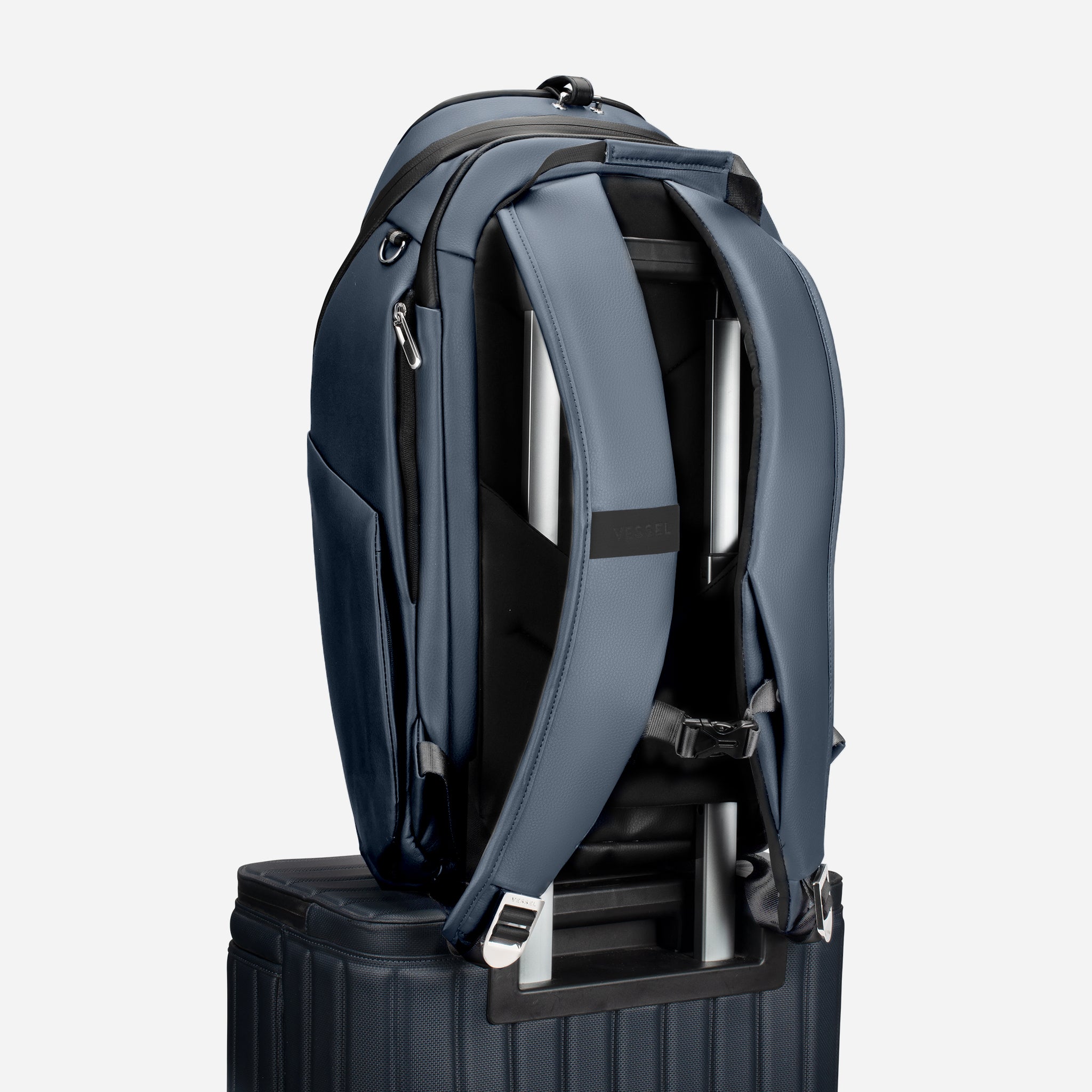 PrimeX 2.0 Backpack Marine on top of luggage