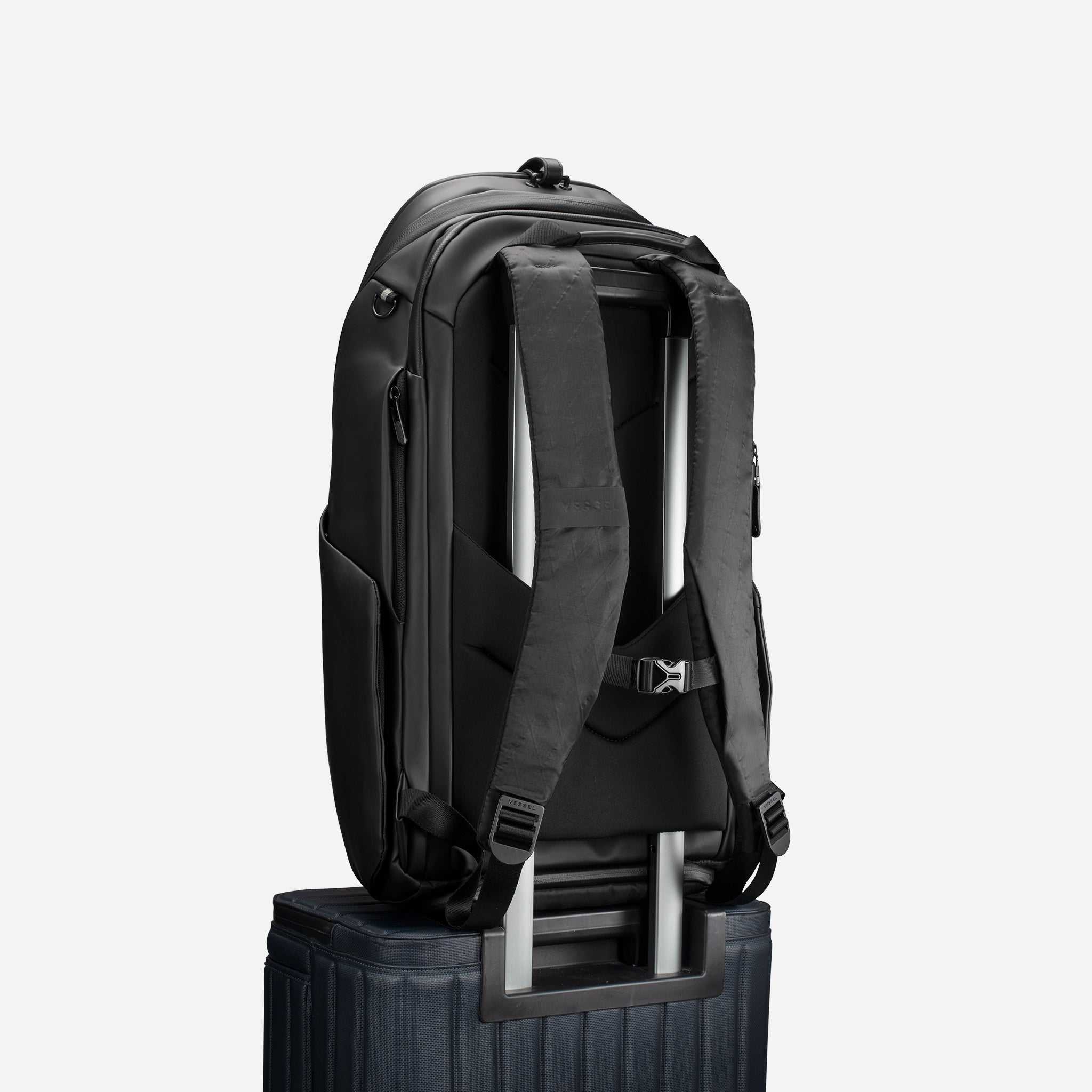 PrimeX 2.0 DXR Plus Backpack on top of luggage