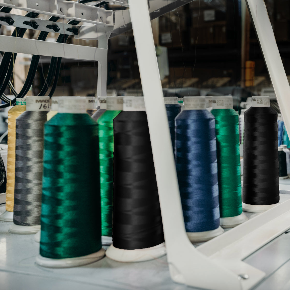 Colorful spools of thread on an embroidery machine