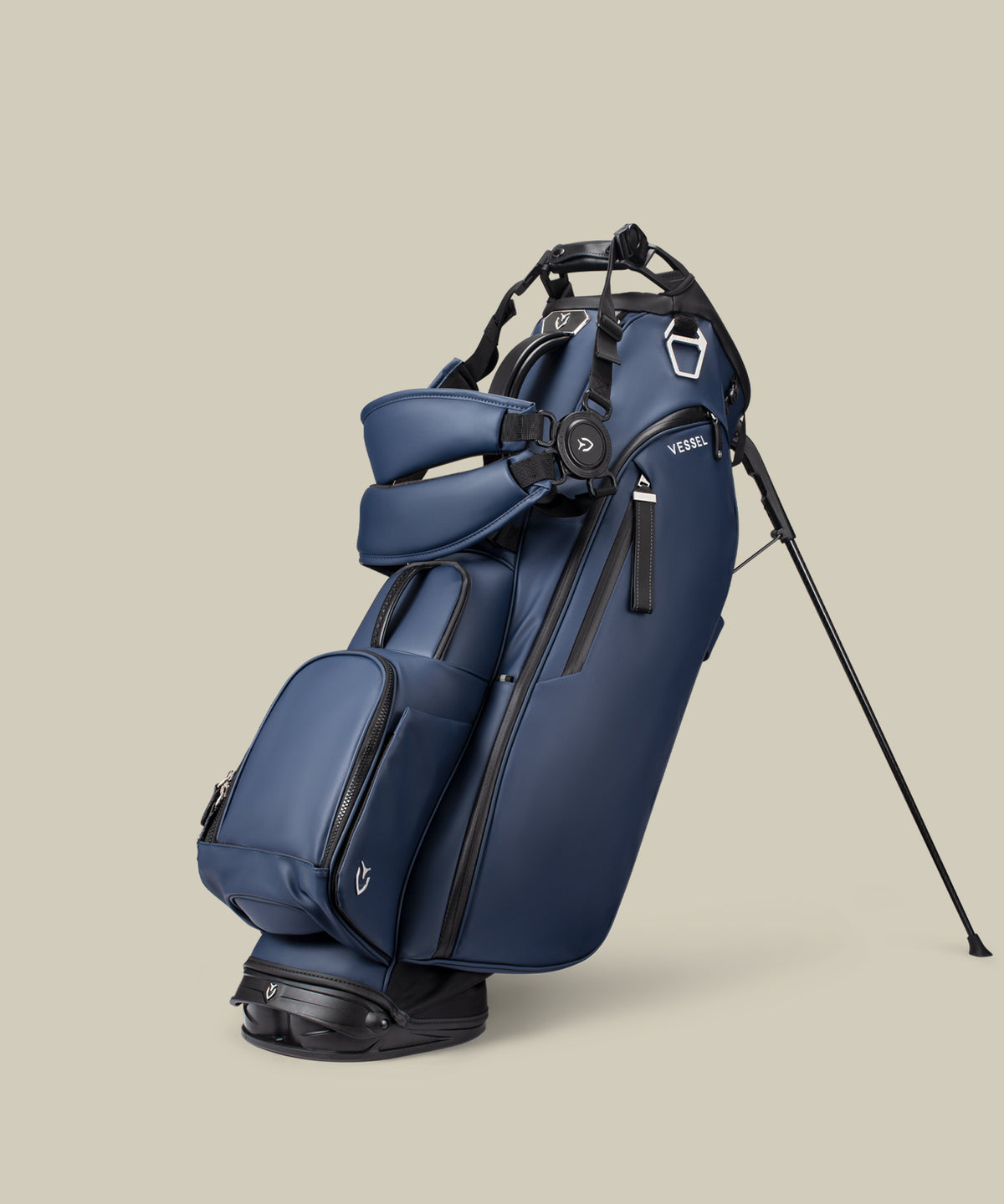 Navy Player V Stand bag on a taupe background