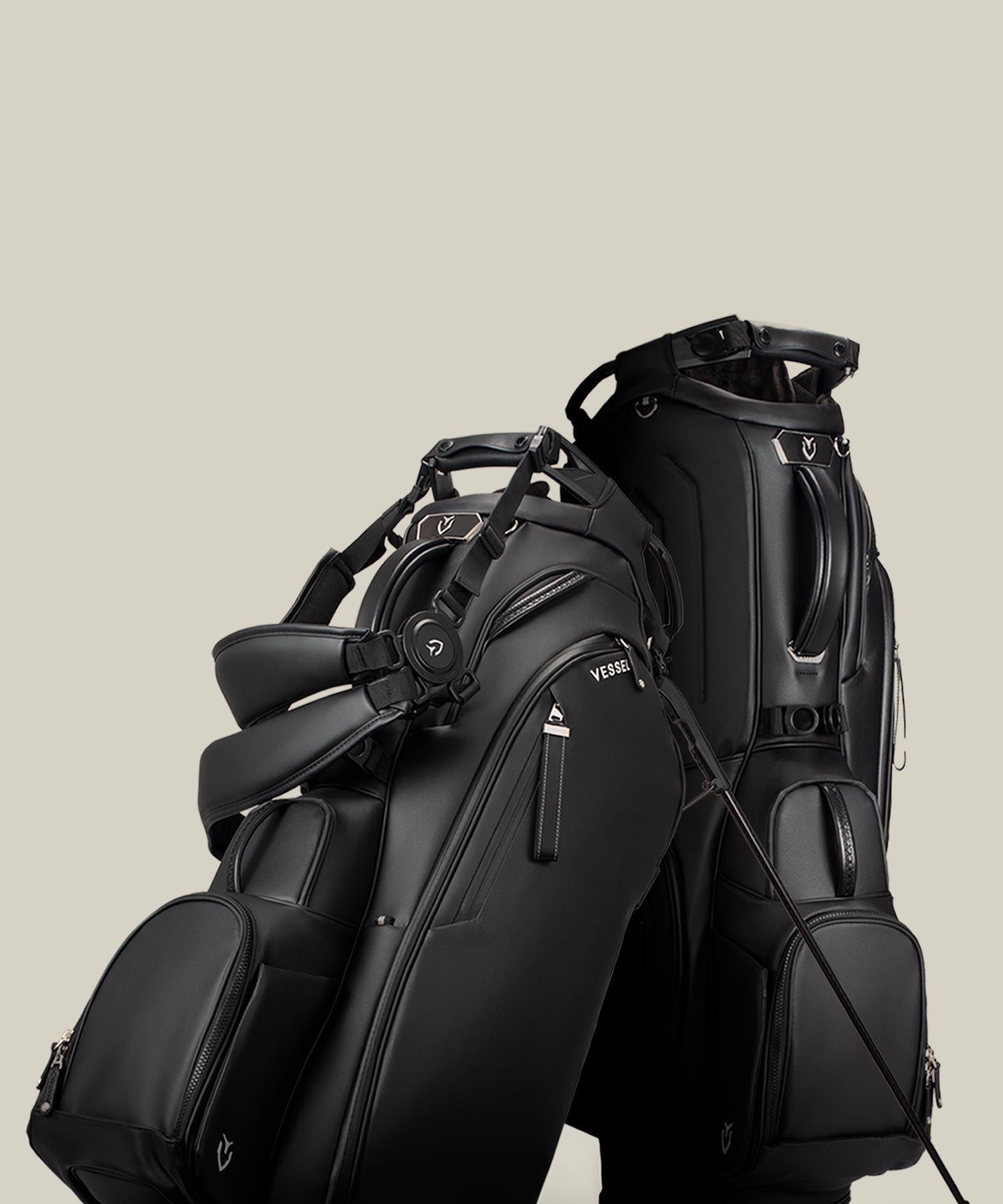 Two black Player V Pro Stand bags against a taupe background