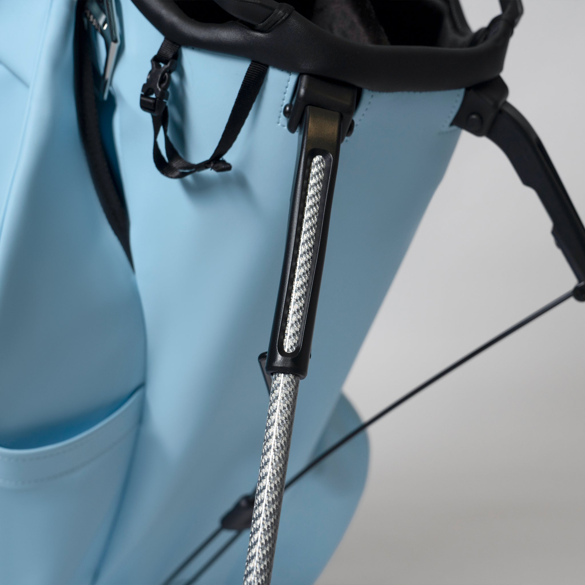 Close up of carbon fiber legs on Player V Stand Sky golf bag