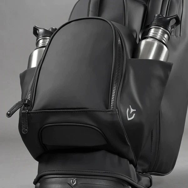 Close up of ball pocket and dual beverage sleeves on black golf stand bag