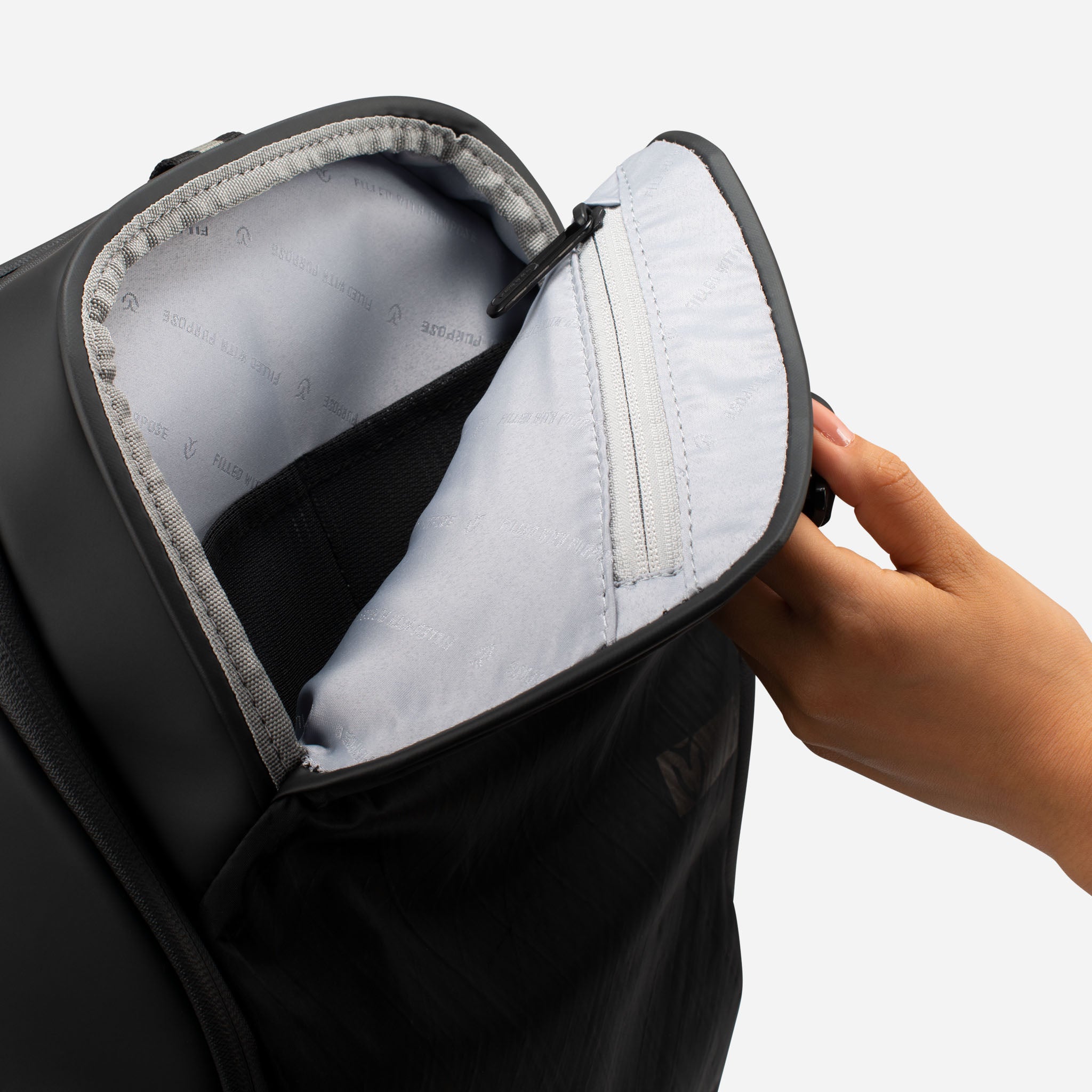 Open top magnetic pocket on black tennis backpack