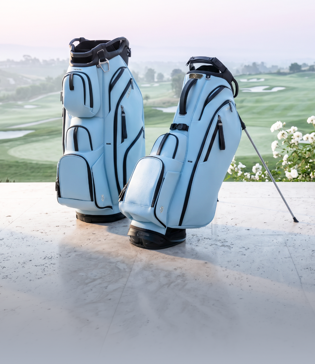 Sky colored leather golf bags against a golf course