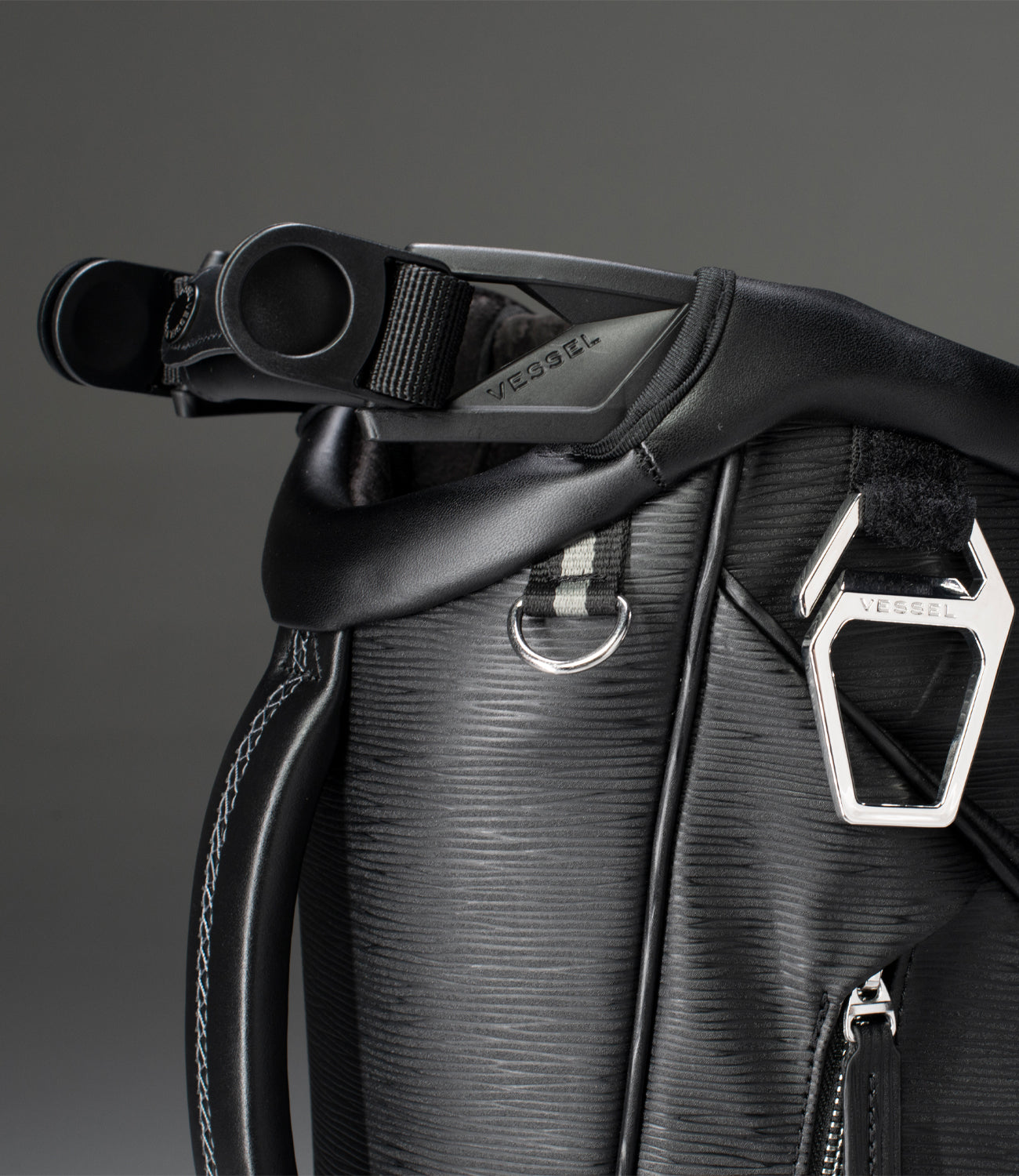 Close up image of top profile of black leather stand bag