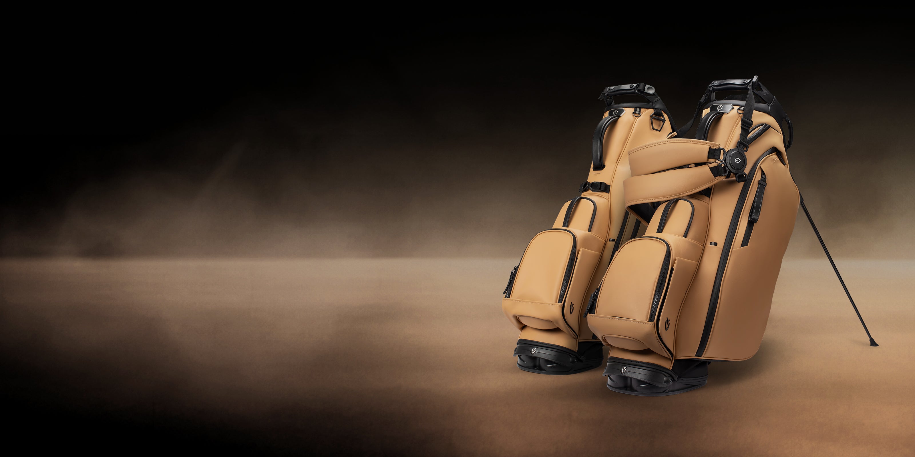 Two Iron Brew Player series golf bags on a tan gradient