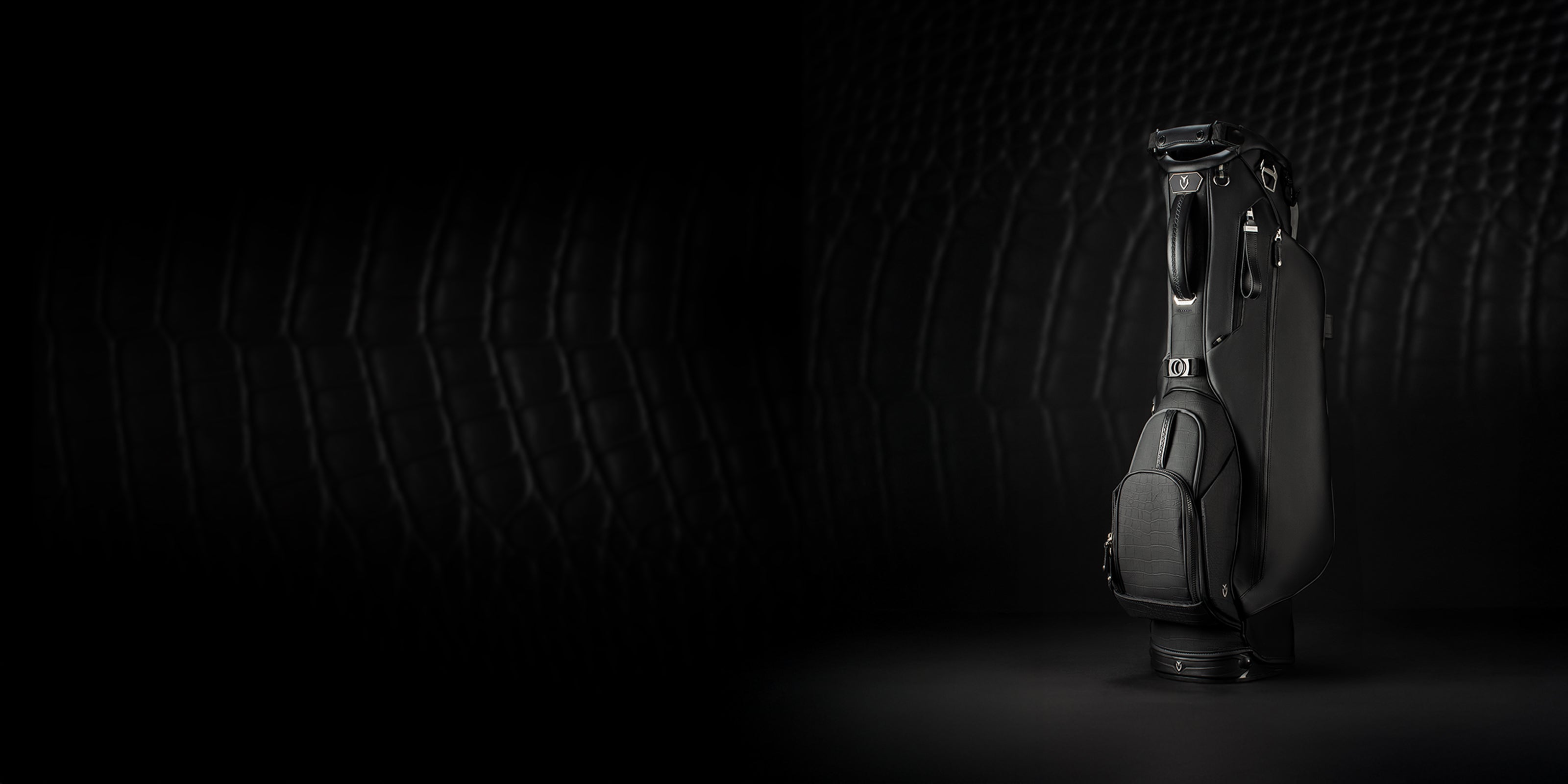Croc Black Lux Stand bag standing vertically on black background
