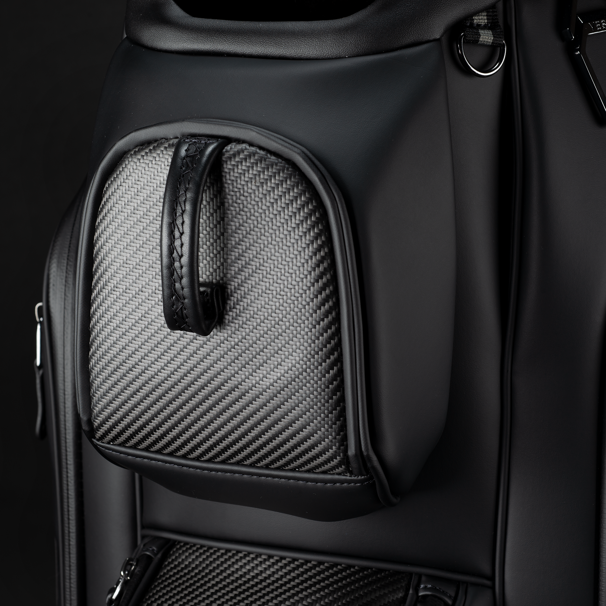 Close up of the magnetic rangefinder pocket with carbon fiber material on the Lux Pro Carbon Cart Bag.