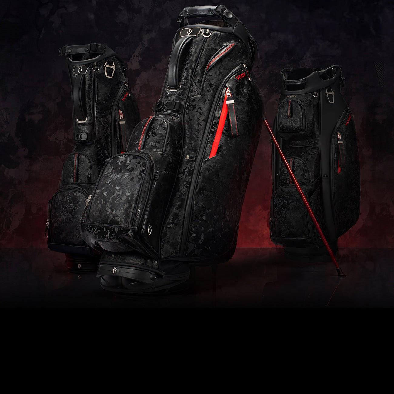Three black and red camo leather golf bags