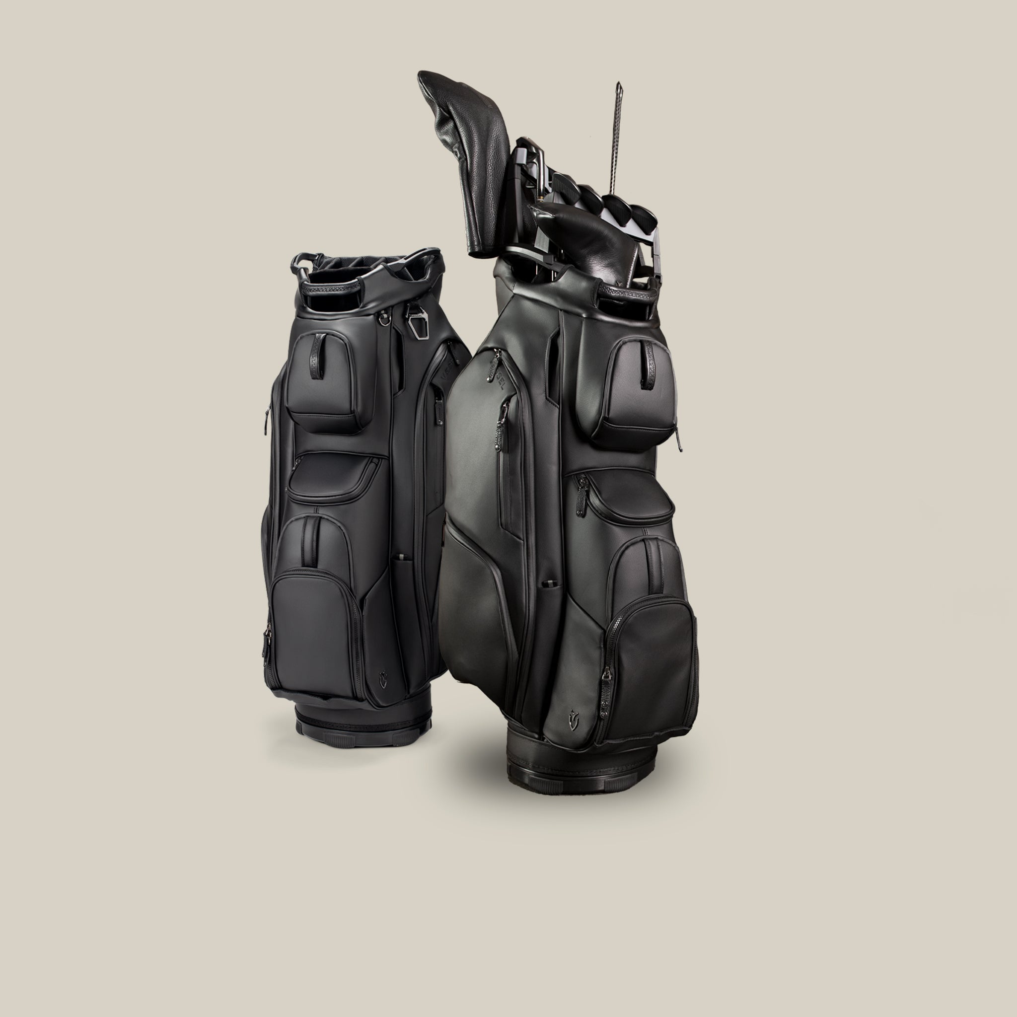 Two black golf cart bags on a taupe background